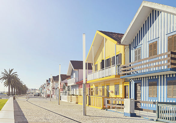 Row of colourful beach houses in Costa Nova, Portugal